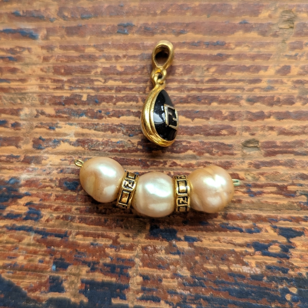 Two vintage FENDI pendants